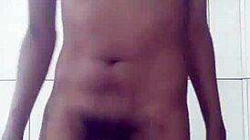 young guy playfully stroking his cock in sexy solo session