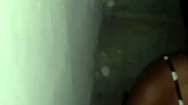 in the unfinished building, the young latina guy gives oral to the black cock, leading to anal and orgasm outdoors.