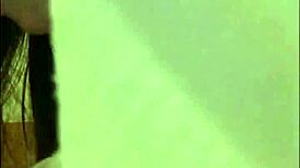 Brunette strips and shows her wet pussy.