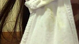 Brunette strips and shows her wet pussy.