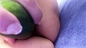 mature central american lady masturbating with a big cucumber