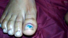 Ebony foot job with cumshot on feet