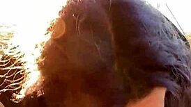 Feeling the passion as she gives a blowjob on the beach