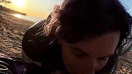 Feeling the passion as she gives a blowjob on the beach