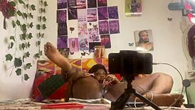 She masturbates alone with a dildo, fingering her pussy while bent over in front of the mirror.