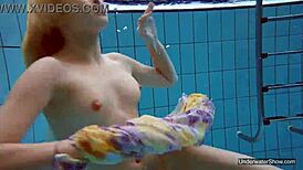 Petite teen Milana Voda braves naked underwater swim session