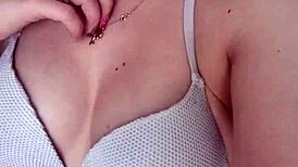 Teen brunette with blue eyes and piercing teases by the pool before swimming.