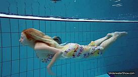 Petite teen Milana Voda braves naked underwater swim session