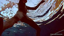 Petite teen Milana Voda braves naked underwater swim session