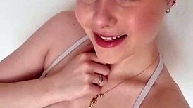 Teen brunette with blue eyes and piercing teases by the pool before swimming.