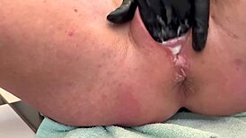 european housewife fingers her asshole with three gloves, gaping it wide, and pees at the end