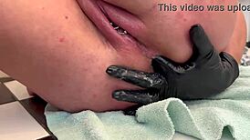 european housewife fingers her asshole with three gloves, gaping it wide, and pees at the end