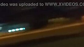 Public Outdoor Encounter with Husband on Grass, Guard Witnesses Intimate Moment.