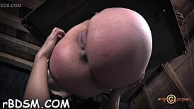 this brunette woman is shoving a big rubber dildo deep inside