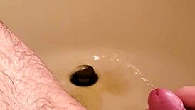 Watch this old man PISS on the shaved hairless cock with his SMALL DICK!