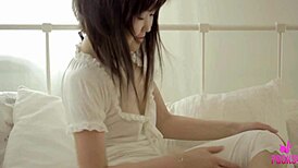 After waking up, Asian beauty masturbates in the bedroom