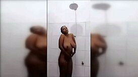 German video has African American teen with large breasts showering