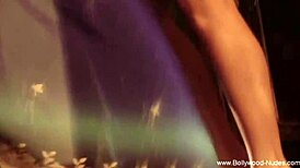 Brunette asian strips seduces while dancing nude