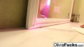 Olivia relaxes in the shower