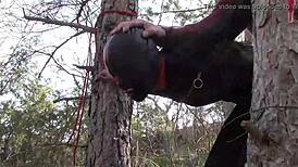 Yo, tied her up outdoors in pantyhose and boots for a rough bang! 😈