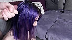 Purple-haired girl receives cum on face in blowbang bukkake