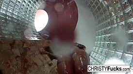 Steamy shower turned wild with Christy, Dahlia, and Ivan enjoying hot lesbian play. Their tattooed bodies glistened under water.