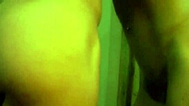 busty ginger shows off muscles in mirror