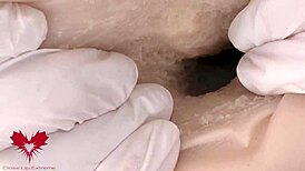 Mistress in White Latex Gloves Commands Ejaculation into Tomax Venus Real Onahole