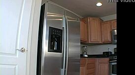 beautiful blonde in lingerie shows big breasts during kitchen photoshoot