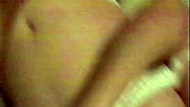 Busty brunette in white lingerie performs oral and receives necklace.