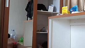 Sexy gay in red cd and mask plays with toys