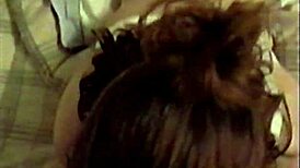 Busty brunette in white lingerie performs oral and receives necklace.