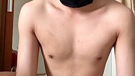 Sexy gay in red cd and mask plays with toys