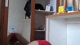 Sexy gay in red cd and mask plays with toys