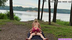 naked blonde rides outdoors, cumshot lands on bouncing tits
