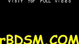 Nude beauty in bondage sucks sex toy hungrily.