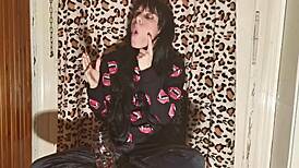 smoking goth girl relaxes behind the scene after a long day?