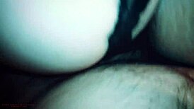 young stepmom enjoys a private moment with her stepson in the bedroom