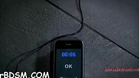 Beauty tied upside down in garage for intense play.