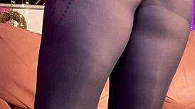 She masturbates in black pantyhose, reaching orgasm while wearing heels and leggings.