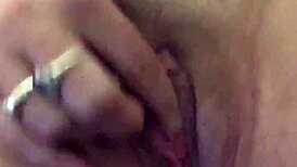 Using vibrator on her dry pussy lips, teasing those sexy folds with intense toy play.