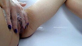 golden rain close-up with intense muff diving on a shaved hairless pussy.