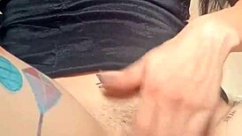 Woman with huge pussy lips shows off hairy goth tits and masturbates