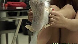 Redheaded Babe Gets Footjob Cumshot