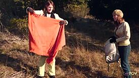 Lesbian couple shares a kiss outdoors, then heats up with a strapon.