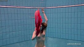 Feeling the thrill of firm tits in red dress underwater