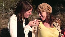 Lesbian couple shares a kiss outdoors, then heats up with a strapon.