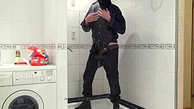 Master In Blue Jeans Washes Feet In Bathroom