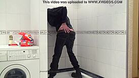 Master In Blue Jeans Washes Feet In Bathroom