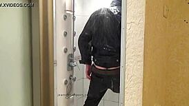 Master In Blue Jeans Washes Feet In Bathroom